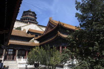 Angled view looking up at the complex buildings from a courtyard