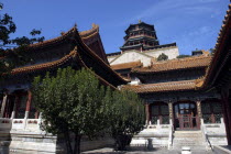 Angled view looking up at the complex buildings from a courtyard