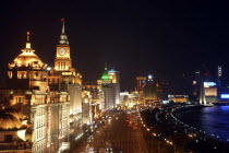 Aerial view along the city waterfront illuminated at night