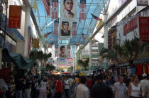 View along a covered market street lined with stalls