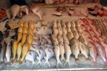 Display of various fish on ice at the market