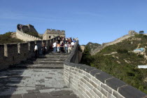 View along a section of the wall with tourists walking down steps