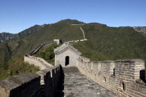 View along a section of the wall which runs through the green hilly landscape