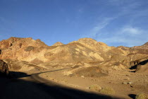 View over layered sculpted rock hills in the golden afternoon sun