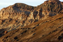 View of red layered sculpted rock hills