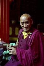 Portrait of monk performing Pujar ceremony  and the making of a spiritual Mandala