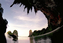 Wide angle view of Rai Ley beach framed by overhanging cliffs