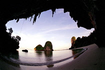 Wide angle view of Rai Ley beach framed by overhanging cliff