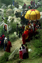 Parade toward the Thangka and onlookers at a silken Thangka Buddhist ceremony for the cycle of life