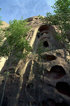 Angled view looking up at section of the Mati sa Temple built in to the cliff face