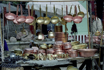 Close up of pots and pans displayed on a household goods market stall