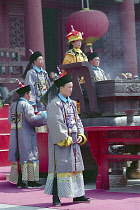 People dressed as Guards and an Emporer at a reenactment