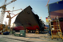 Dae-woos new ship building yard with section of ship surrounded by cranes