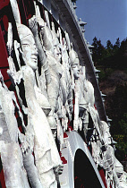 Peace Bridge. Detail of white carved figures adorning the side of the footbridge
