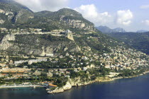 Aerial view from the sea toward the hillside coastal city and coastline