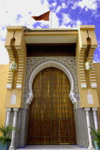 Exterior of building door with flag flying on roof