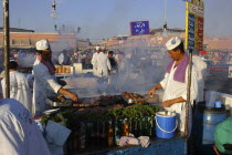 Djemaa El Fna. Market stall with two men cooking food