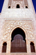 Hassan II Mosque massive stone arch doorway in tower