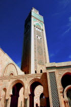 Angled view looking up at the tower of Hassan II Mosque