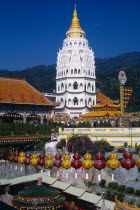 General view of temple complex and Ban Po  the Pagoda of a Thousand Buddhas with string of red and yellow Chinese lanterns in the foreground.