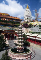 General view of temple complex with Ban Po  the Pagoda of a Thousand Buddhas in background and circular pond with seven tiered pagoda sculpture in centre in front.