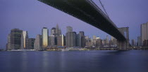 Lower Manhattan.  Post September 11 skyline from Brooklyn at dusk with Brooklyn Bridge in the foreground.