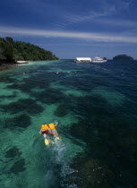 Pulau Paya marine national park with two tourists snorkling above the coral reef Asian Malaysian Southeast Asia 2 Holidaymakers Scenic Tourism