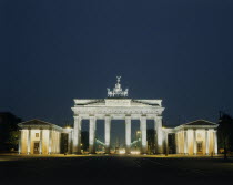 Brandenburg Gate floodlit at night seen from the front