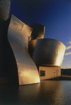 The Guggenheim Museum deatail with golden sunshine reflected at sunset