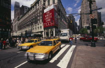 Macys department store with taxis and pedestrians in a busy street
