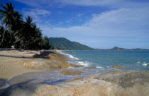 Lamai beach with rocks exposed at low tide