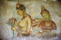 Frescoe of two women in cave on the side of the Hindu hill temple fort