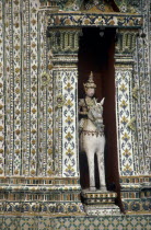 Wat Phra Kaeo close up statue of a horseman set into an alcove of a decorative building