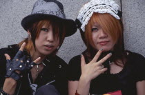 Harajuku District. Portrait of two girls dressed in teenage Japanese style