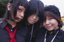 Harajuku District. Portrait of three girls dressed in teenage Japanese style