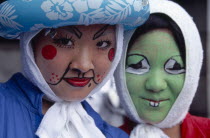 Harajuku District. Portrait of two girls smiling wearing face paint
