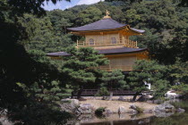 Kinkaku Ji Temple aka the Golden Pavilion seen through treesAsia Asian Japanese Nihon Nippon Religion Pavillion Religious