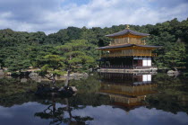 Kinkaku Ji Temple aka the Golden Pavilion seen over pondAsia Asian Japanese Nihon Nippon Religion Religious Pavillion