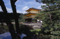 Kinkaku Ji Temple aka the Golden Pavilion seen through treesAsia Asian Japanese Nihon Nippon Religion Religious Pavillion