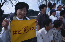 Tour guide holding sign with tour group at the Imperial Palace