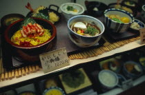 Plastic food displayed in the window of a restaurant