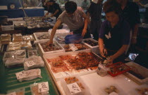Tsukiji Fish Market with displays of various seafood