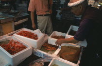 Tsukiji Fish Market with crates of prawns
