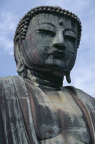 Angled view looking up at the head of the Daibutsu aka Great Buddha statue dating from 1252