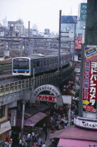 View over the busy Ameyayokocho market street and the elevated train tracks above
