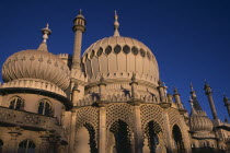 Brighton Pavilion exterior section showing onion domes in evening lightEuropean Great Britain Northern Europe UK United Kingdom Warm Light British Isles Pavillion