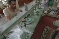 Man polishing precious stones