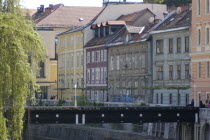 River Ljubljanica. View along row of Austro Hungarian buildings toward the Old Town