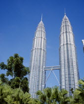 Petronas Twin Towers. Angled view looking up at the multi storey buildings housing corporate headquarters