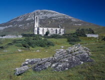 Ruined church in The Poisened Glen with Errigal peak of the Derryveagh Mountain Range behind